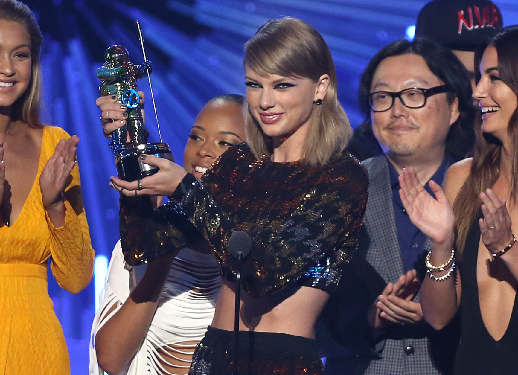 Taylor Swift accepts the award for video of the year for Bad Blood at the MTV Video Music Awards at the Microsoft Theater on Sunday, Aug. 30, 2015, in Los Angeles. Pictured from left is Gigi Hadid, Serayah, director Joseph Kahn and Lily Aldridge. (Photo by Matt Sayles/Invision/AP)