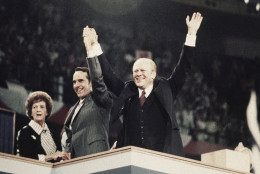 Sen. Robert Dole, center, his mother Bina Dole, left, and Pres. Gerald Ford shown on the final night of the Republican National Convention in Kemper Arena, Aug. 19, 1976, Kansas City, Mo. (AP Photo)