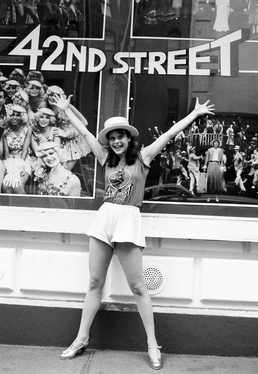 On this date in 1980, the Broadway musical "42nd Street" opened. Here, performer Lisa Brown poses outside the Majestic Theater in New York City on June 30, 1982. (AP Photo/Suzanne Vlamis)