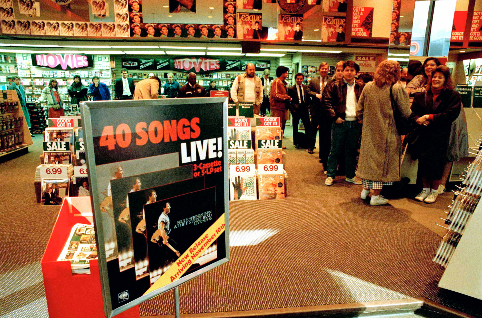 On this date in 1975, the Bruce Springsteen album "Born to Run" was released by Columbia Records. Here, buyers at Sam Goody's Record Store in midtown Manhattan wait for Bruce Springsteen's first live album to go on sale in New York, Monday, Nov. 10, 1986. (AP Photo / Richard Drew)