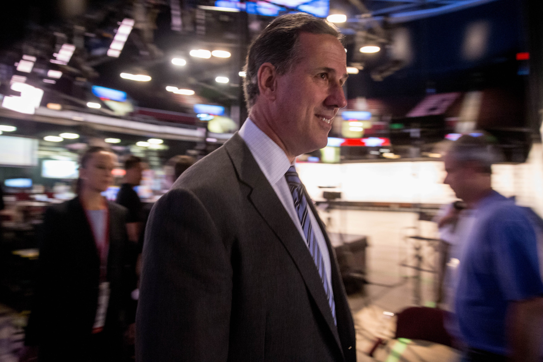 Republican presidential candidate, former Pennsylvania Sen. Rick Santorum walks into the the Quicken Loans Arena in Cleveland, Thursday, Aug. 6, 2015, before tonight's first Republican presidential debate. Santorum has not qualified for the primetime debate and will be participating in a pre-debate forum with six other non-qualifying candidates. (AP Photo/Andrew Harnik)