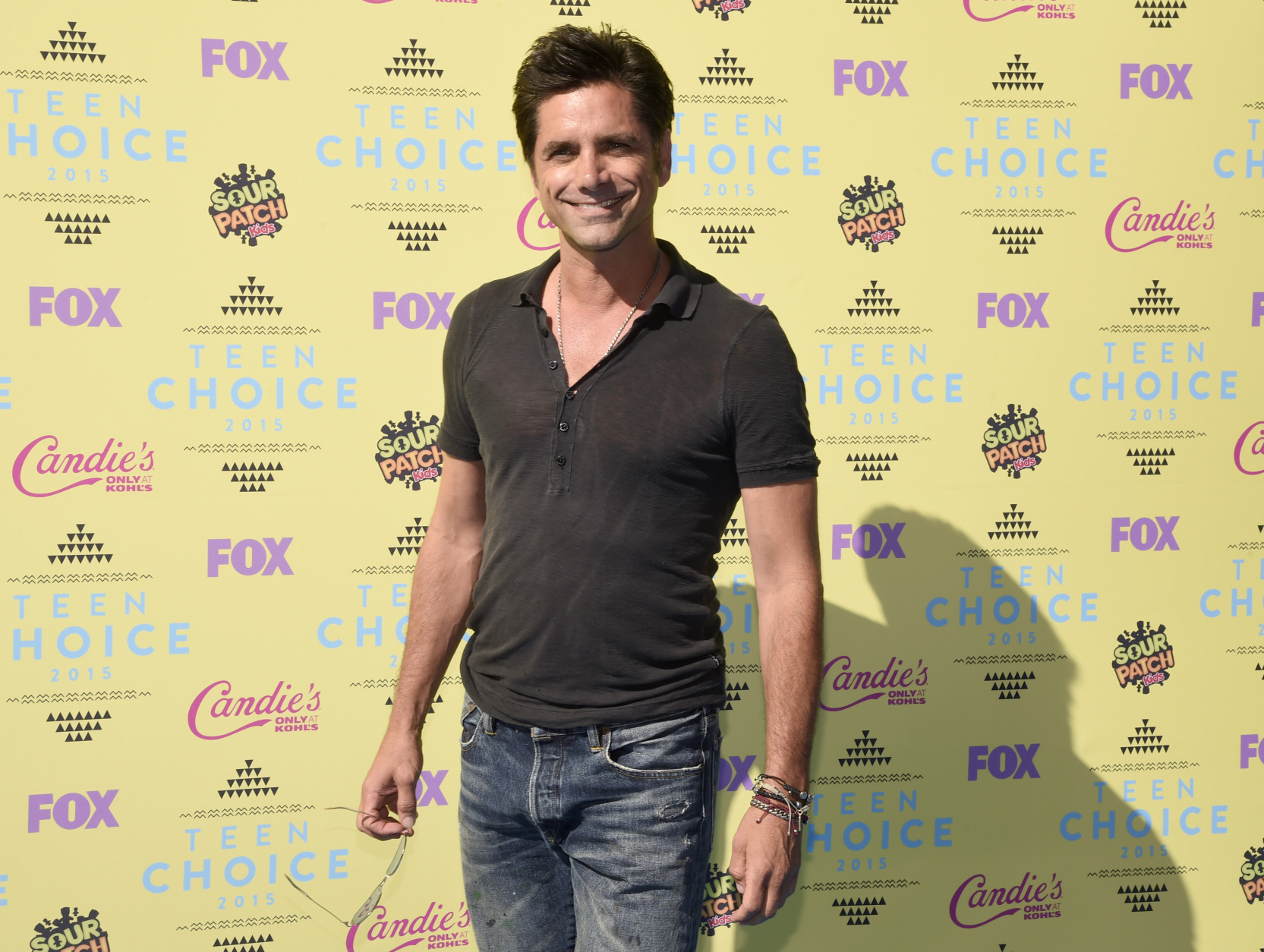 John Stamos arrives at the Teen Choice Awards at the Galen Center on Sunday, Aug. 16, 2015, in Los Angeles. (Photo by Chris Pizzello/Invision/AP)