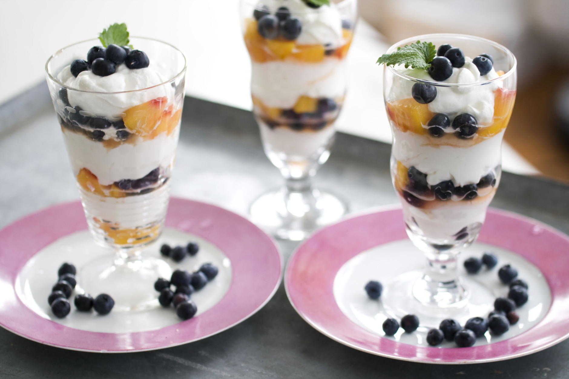 In this image taken on April 15, 2013, easy blueberry-peach mousse parfaits are shown in Concord, N.H. (AP Photo/Matthew Mead)