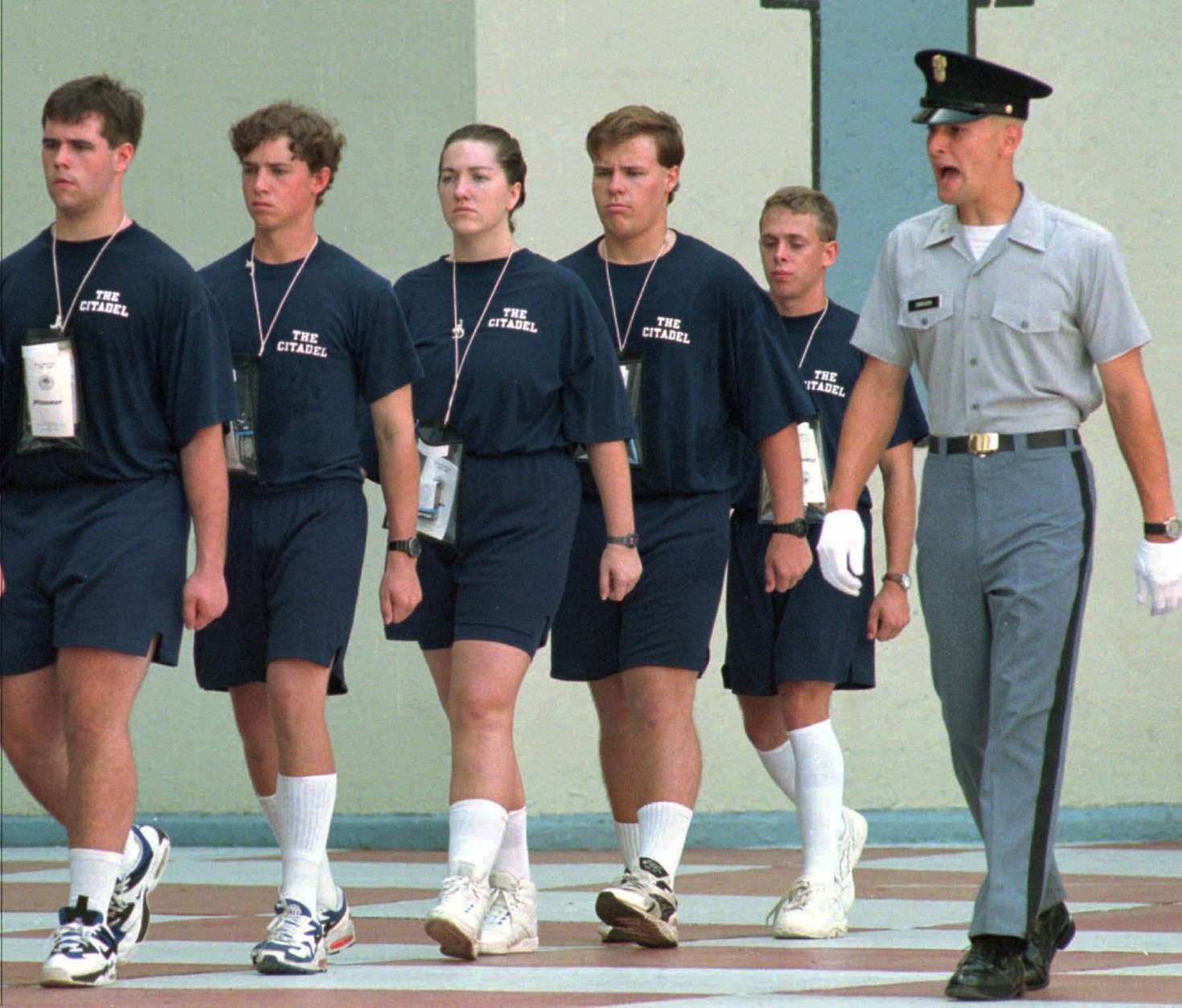 On this date in 1995, Shannon Faulkner officially became the first female cadet in the history of The Citadel, South Carolina's state military college. Here, Faulkner, center, marches with her company on Monday, Aug. 14, 1995. (AP Photo/Wade Spees, Pool)
