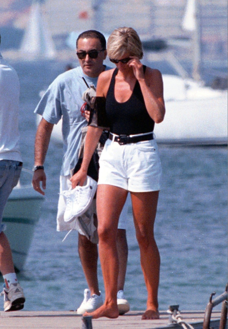 On this date in 1997, a car crash in Paris claimed the lives of Princess Diana, Dodi Fayed and their driver, Henri Paul. Here, Princess Diana and Fayed walk on a pontoon in the French Riviera resort of St Tropez Friday Aug. 22, 1997. (AP PHOTO/Patrick Bar-Nice Matin)