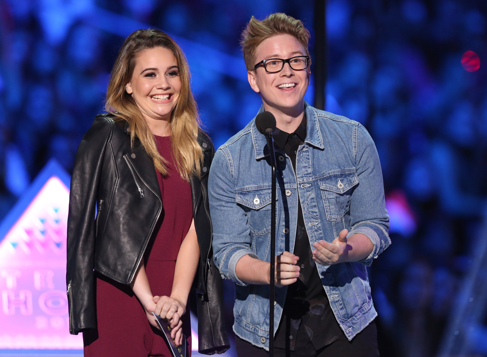 Bea Miller, left, and Tyler Oakley present the choice tv: drama award at the Teen Choice Awards at the Galen Center on Sunday, Aug. 16, 2015, in Los Angeles. (Photo by Matt Sayles/Invision/AP)