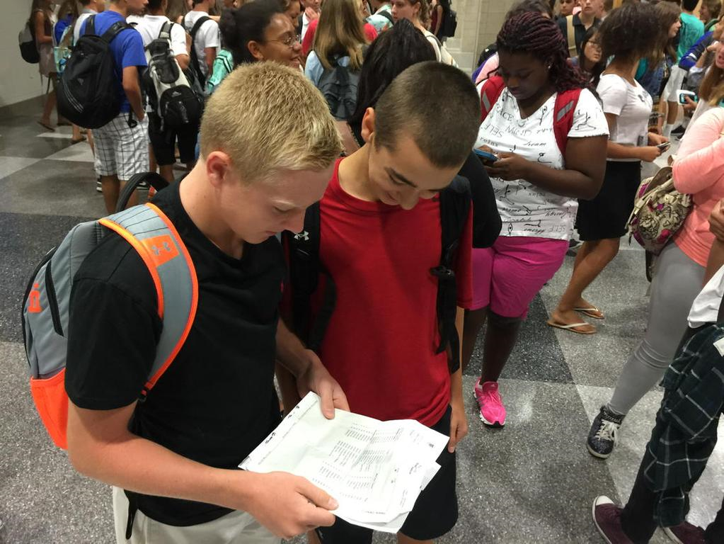 Freshmen Carson Swank and Ryan Murray check out class schedules at Riverside high School. (WTOP/Kristi King)
