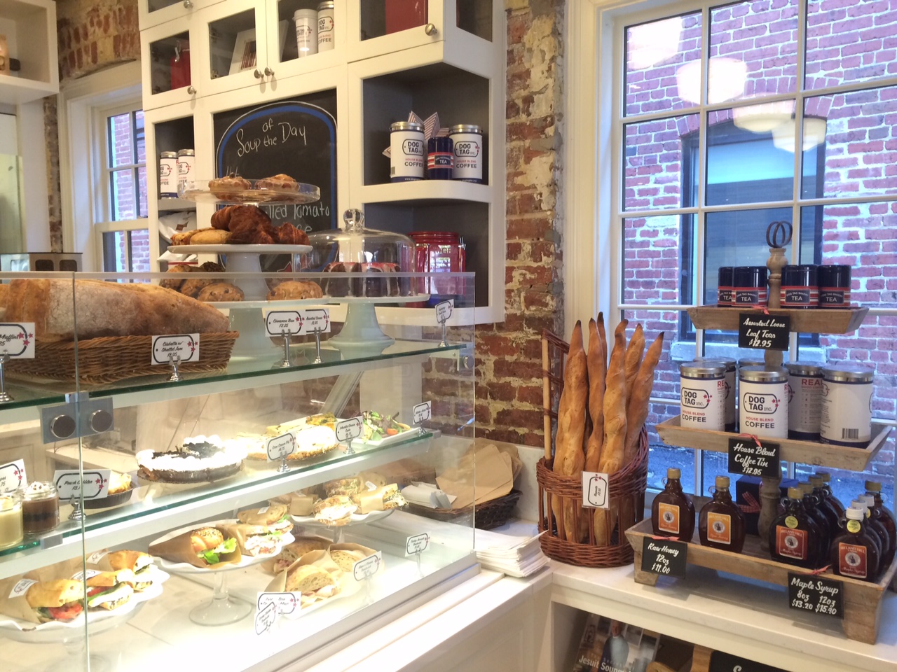 The display cases at Dog Tag Bakery are filled with freshly baked breads, pastries, pies and sandwiches. Around breakfast and lunch time, locals and tourists file into the café on the canal and pack the tables in the first-floor dining room.  (WTOP/Rachel Nania)