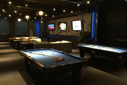 The lower level lounge has pool tables, shuffleboard, TVs and Xbox Kinect. (WTOP/Michelle Basch)