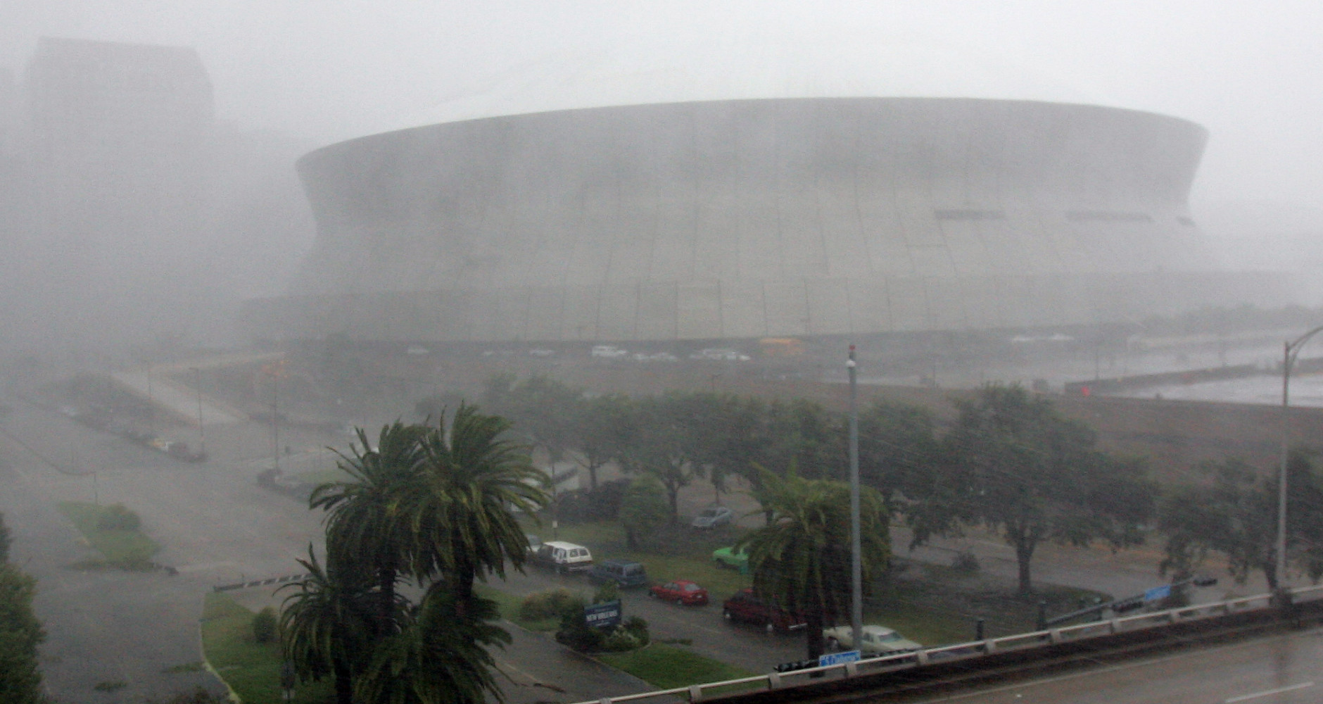High winds and rain pound the Louisiana Superdome and New Orleans as Hurricane Katrina makes landfall along the Louisiana coast on Monday, Aug. 29, 2005. Officials report that part of the roof of the Superdome was blown off because of the storm and the facility, which is housing some 10,000 evacuees, is leaking.  (AP Photo/Dave Martin)