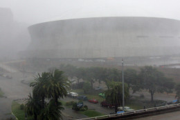 High winds and rain pound the Louisiana Superdome and New Orleans as Hurricane Katrina makes landfall along the Louisiana coast on Monday, Aug. 29, 2005. Officials report that part of the roof of the Superdome was blown off because of the storm and the facility, which is housing some 10,000 evacuees, is leaking.  (AP Photo/Dave Martin)