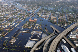 From an aerial view floodwaters from Hurricane Katrina fill the streets near I-10 in downtown New Orleans Tuesday, Aug. 30, 2005. (AP Photo/David J. Phillip)