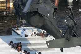 New Orleans residents are rescued  by helicopter from the floodwaters of  Hurricane Katrina Wednesday, Aug. 31, 2005 in New Orleans. (AP Photo/David J. Phillip)