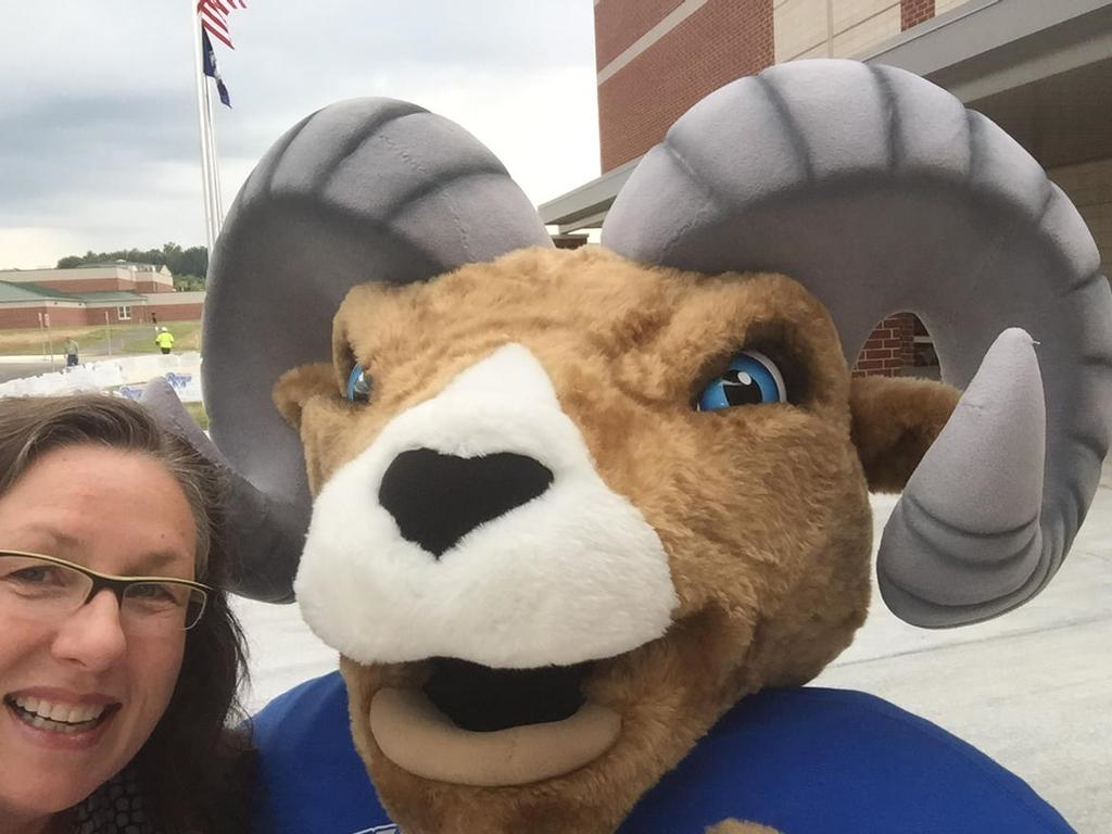 The Riverside high School Rams' new mascot and a new friend. (WTOP/Kristi King)