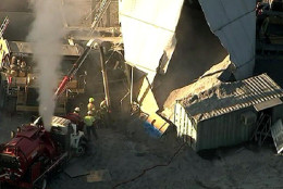 Fire and rescue personnel are looking for a missing worker after a silo collapsed in Ashburn, Virginia, Monday morning. (NBC Washington)