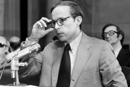 John Dean III, former White House aide in the Nixon Administration, adjusts his eyeglasses as he nears the end of reading his 245-page prepared statement before the Senate Watergate Committee in Washington, D.C., on June 25, 1973. In his seven-hour opening statement Dean said that the president was involved in the cover-up of the Watergate burglary. (AP Photo)