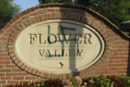 Police received a call from a resident who told them there was a green swastika on the “Flower Valley” neighborhood entrance sign in the area of Norbeck Road and Westbury Road. (Courtesy Montgomery County Police)