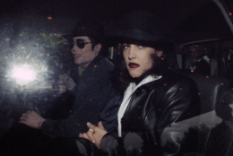 On this day in 1994, pop icon Michael Jackson and Lisa Marie Presley, daughter of Elivis, confirm they were secretly wed 11 weeks before. Here, Jackson and Presley leave a hotel at Euro Disneyland, Paris, on Sept. 5, 1994. (AP Photo)