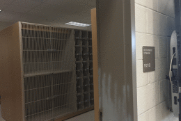 The band room has its own separate instrument storage area with built-in caged cabinets. (WTOP/Max Smith)
