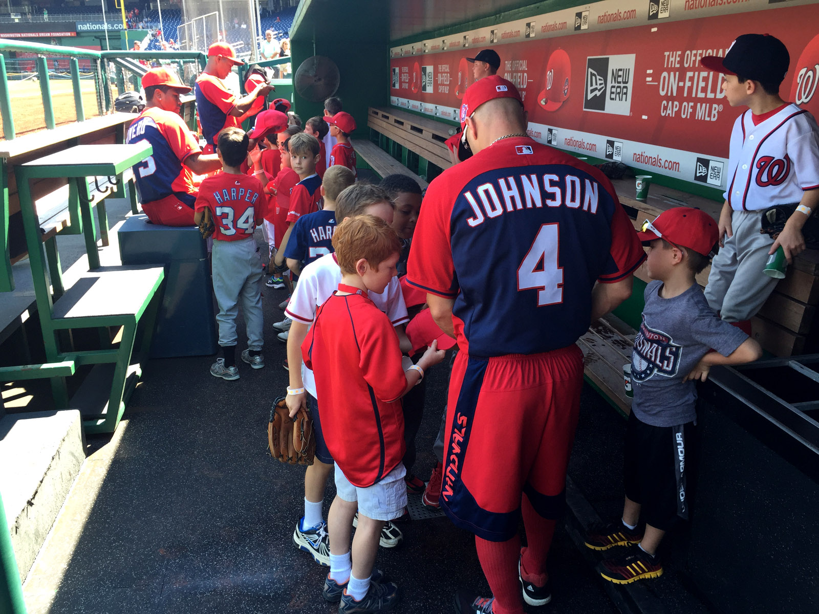 Washington Nationals outfield Reed Johnson talks with some of the young baseball players who spent the day with the team Wednesday through the 2015 National PLAY Campaign, which encourages healthy, active lifestyles. (WTOP/Andrew Mollenbeck)