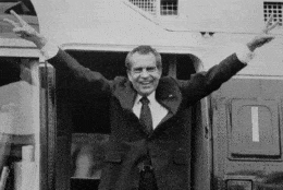 On this day in 1974, President Richard Nixon announced his resignation, effective the next day, following damaging new revelations in the Watergate scandal. In this photo, dated Aug. 9, Nixon says goodbye to members of his staff outside the White House in Washington as he boards a helicopter for Andrews Air Force Base. (AP)