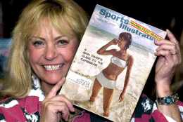 In 1954, Sports Illustrated was first published by Time Inc.
Babette Beatty holds the Jan. 20, 1964, Sports Illustrated in which she graces the cover of the magazine's first swimsuit edition at her Halfway, Ore., business Jan. 19, 2000. (AP)