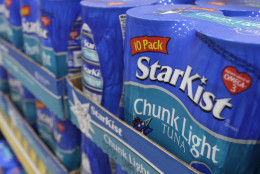 In this photo taken May 19, 2011, Starkist Tuna products sit on a shelf in a Little Rock, Ark., food warehouse . (AP Photo/Danny Johnston)