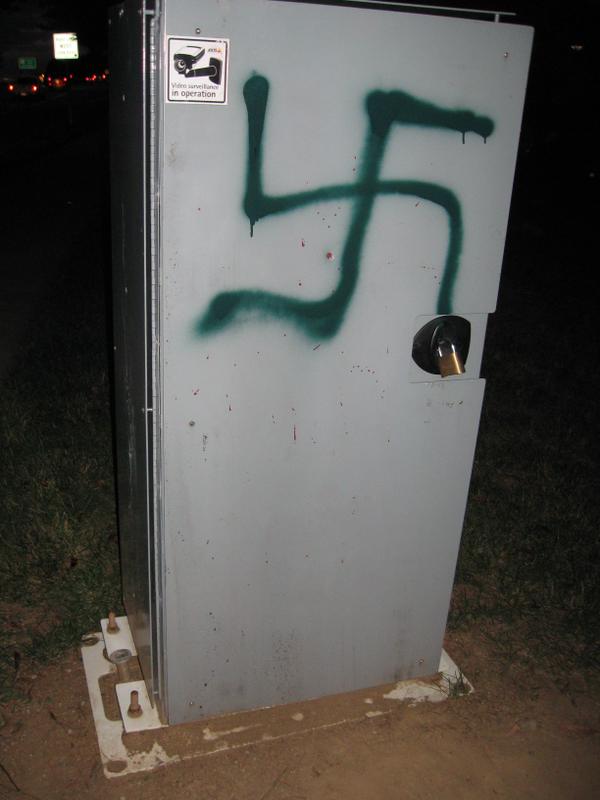 Montgomery County Police say they were driving through Olney, Maryland, on Wednesday morning and spotted a large green-colored swastika painted on a speed camera along Olney Laytonsville Road near Headwaters Drive. (Courtesy Montgomery County Police)