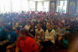 Catholic University of America's auditorium was filled with volunteers on Sunday, Sept. 13, 2015, for a "Walk with Francis" day of community service. (WTOP/Kathy Stewart)