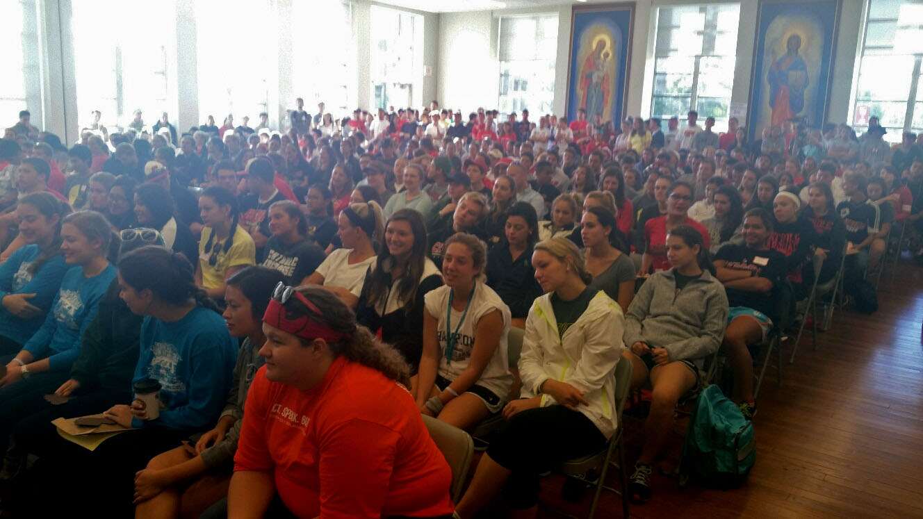 Catholic University of America's auditorium was filled with volunteers on Sunday, Sept. 13, 2015, for a "Walk with Francis" day of community service. (WTOP/Kathy Stewart)
