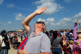 spectators watch the Special Operations Para Commandos Jump Team at the Joint Base Andrews air show on Saturday Sept. 19, 2015. (WTOP/Kathy Stewart)
