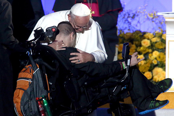 PHILADELPHIA, PA - SEPTEMBER 26:  Pope Francis hugs a disabled man during the Festival of Families on September 26, 2015 in Philadelphia, Pennsylvania. Pope Francis is wrapping up his trip to the United States with two days in Philadelphia where he will attend the Festival of Families and will meet with prisoners at the Curran-Fromhold Correctional Facility.  (Photo by Carl Court/Getty Images)
