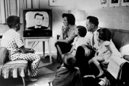 Typical American family gathered around TV, which displays John F. Kennedy's face, to watch debate between Kennedy &amp; Richard Nixon during presidential election.  (Photo by Time Life Pictures/National Archives/The LIFE Picture Collection/Getty Images)
