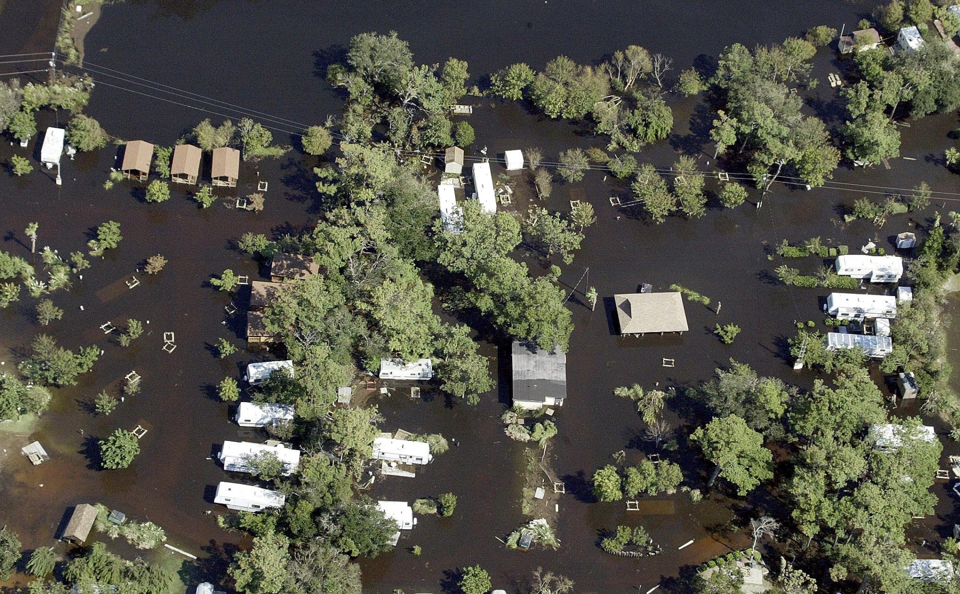 Flood waters surround homes in Buxton, N.C., Friday Sept. 19, 2003 after flooding from Hurricane Isabel. (AP Photo/Chuck Burton)