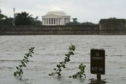The overflowing Tidal Basin covers a walkway across from the Jefferson Memorial in Washington Friday, Sept. 19, 2003 in the aftermath of Hurricane Isabel. Washington suffered from a rare power vacuum Friday. Thousands of residents were without lights, hundreds of trees littered the landscape and all three branches of government were basically shut down. (AP Photo/Evan Vucci)