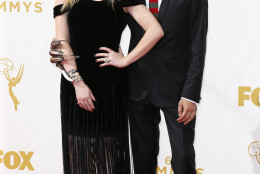 IMAGE DISTRIBUTED FOR THE TELEVISION ACADEMY - Natasha Lyonne, left, and Fred Armisen arrive at the 67th Primetime Emmy Awards on Sunday, Sept. 20, 2015, at the Microsoft Theater in Los Angeles. (Photo by Danny Moloshok/Invision for the Television Academy/AP Images)
