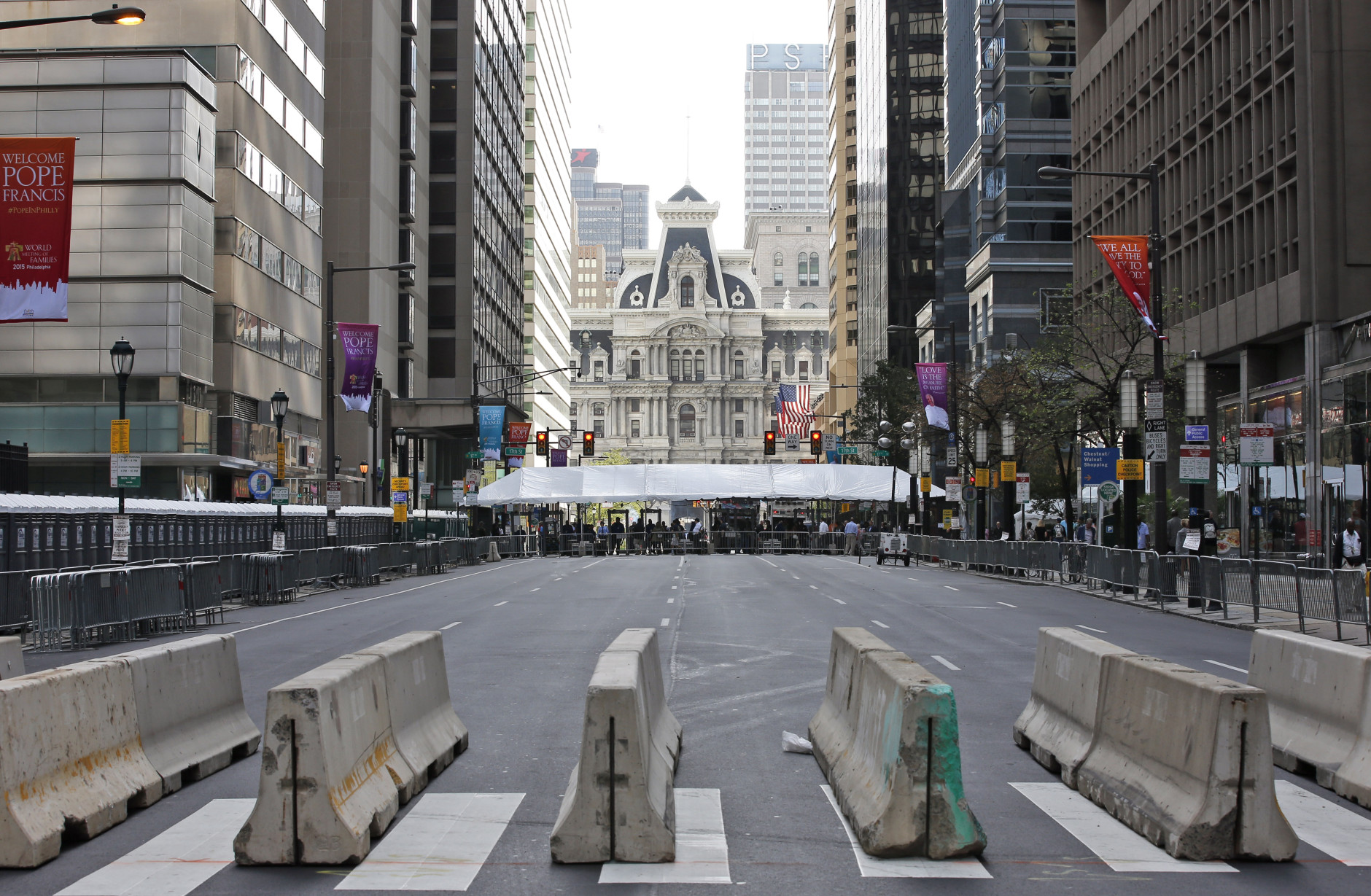 A security checkpoint is set up in the middle of Market Street in Philadelphia on Friday, Sept. 25, 2015 before Pope Francis' upcoming visit. (AP Photo/Alex Brandon)