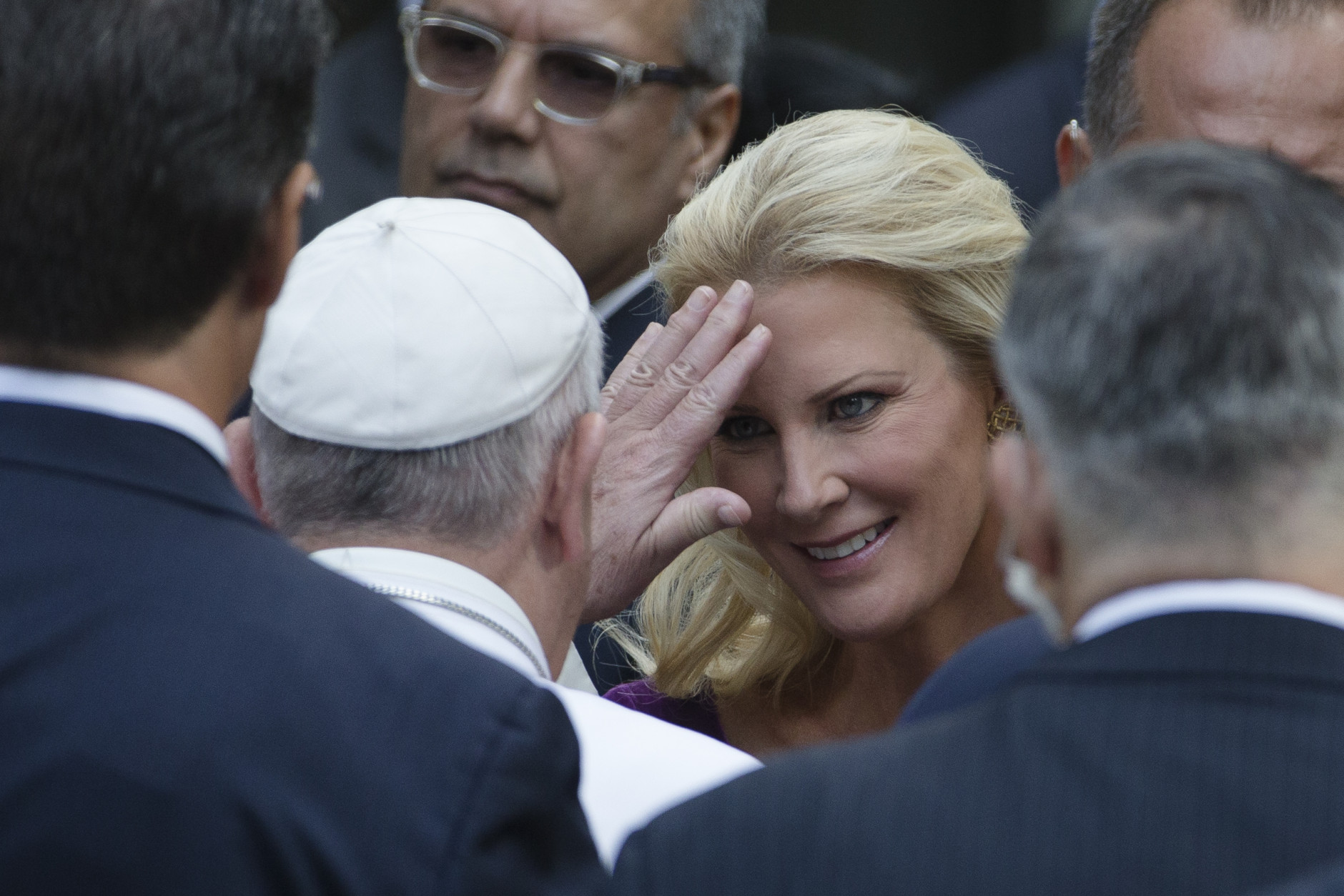 Pope Francis, center left, blesses Sandra Lee, partner of New York Governor Andrew Cuomo, at the South Pool of the 9/11 Memorial in downtown Manhattan, Friday, Sept. 25, 2015, in New York. (AP Photo/John Minchillo)