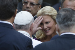 Pope Francis, center left, blesses Sandra Lee, partner of New York Governor Andrew Cuomo, at the South Pool of the 9/11 Memorial in downtown Manhattan, Friday, Sept. 25, 2015, in New York. (AP Photo/John Minchillo)