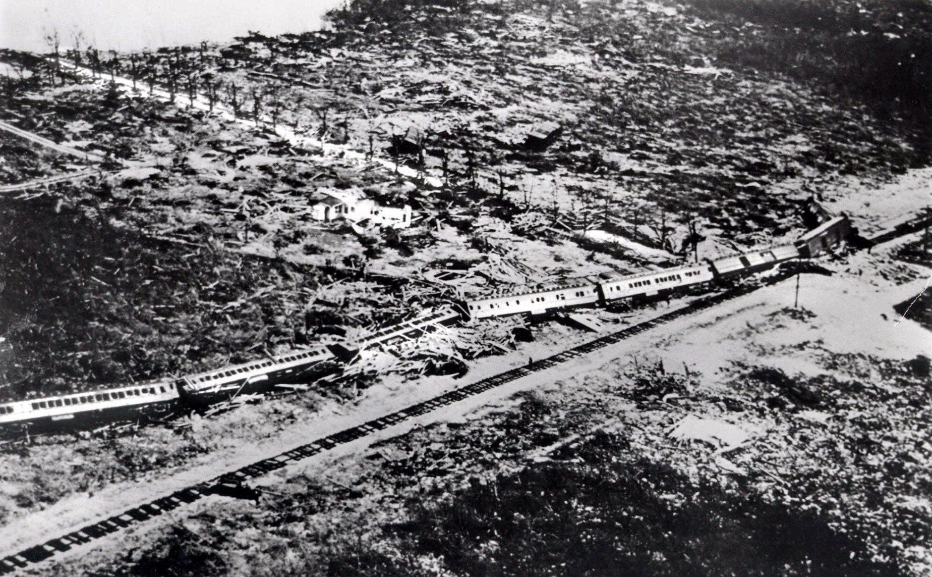 On this date in 1935, a Labor Day hurricane slammed into the Florida Keys, claiming more than 400 lives. Here, the wreckage of an 11-car passenger train is shown after the train was derailled by the hurricane.  (AP Photo)