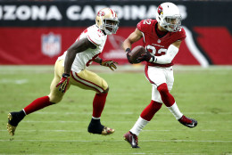 Arizona Cardinals free safety Tyrann Mathieu (32) intercepts a pass intended for San Francisco 49ers tight end Vernon Davis (85) during the first half of an NFL football game, Sunday, Sept. 27, 2015, in Glendale, Ariz.  (AP Photo/Ross D. Franklin)