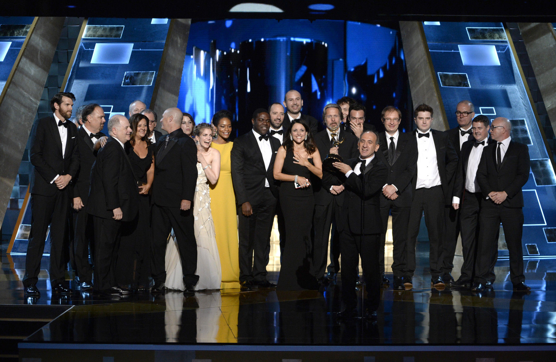 Armando Iannucci, center, and the cast and crew of "Veep" accept the award for outstanding comedy series at the 67th Primetime Emmy Awards on Sunday, Sept. 20, 2015, at the Microsoft Theater in Los Angeles. (Photo by Phil McCarten/Invision for the Television Academy/AP Images)