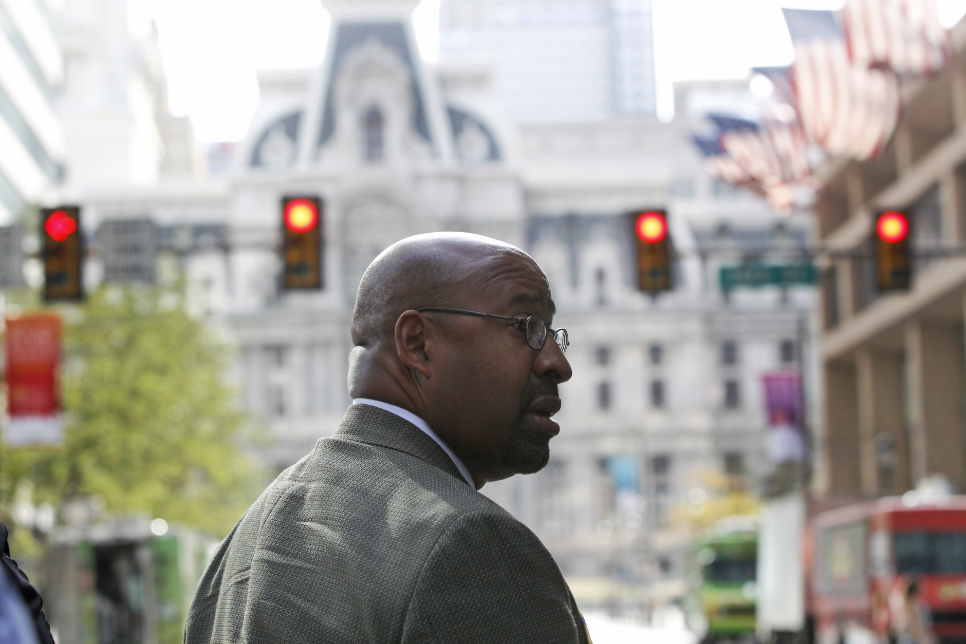 Philadelphia Mayor Michael Nutter walks down a blocked off Market Street, with City Hall in the background, in Philadelphia on Friday, Sept. 25, 2015, before Pope Francis' upcoming trip. (AP Photo/Mel Evans)