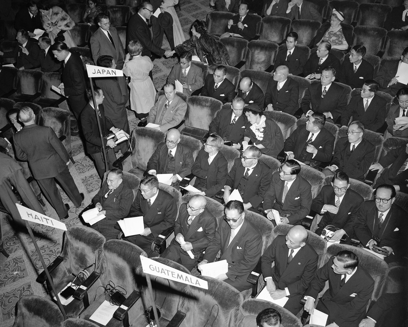 On this date in 1951, President Harry S. Truman addressed the nation from the Japanese peace treaty conference in San Francisco in the first live, coast-to-coast television broadcast. Here, the Japanese delegation to the peace treaty conference await Truman's speech. (AP Photo)