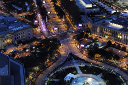 Benjamin Franklin Parkway in Philadelphia is lit up at dusk and lined with tens of thousands of people as Pope Francis makes his way along the thoroughfare, Saturday, Sept. 26, 2015. The pontiff attended a music-and-prayer festival there Saturday night to close out the World Meeting of Families, a Vatican-sponsored conference of more than 18,000 people from around the world. (AP Photo/Michael Perez)