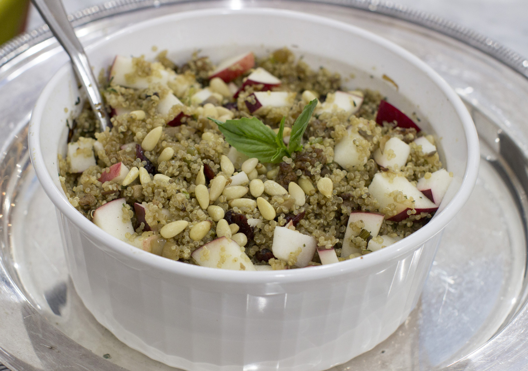 This Dec. 1, 2014, photo shows winter quinoa dressing with apples and dried cranberries in Concord, N.H. (AP Photo/Matthew Mead)