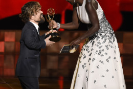 Viola Davis, right, presents Peter Dinklage with the award for outstanding supporting actor in a drama series for Game of Thrones at the 67th Primetime Emmy Awards on Sunday, Sept. 20, 2015, at the Microsoft Theater in Los Angeles. (Photo by Chris Pizzello/Invision/AP)