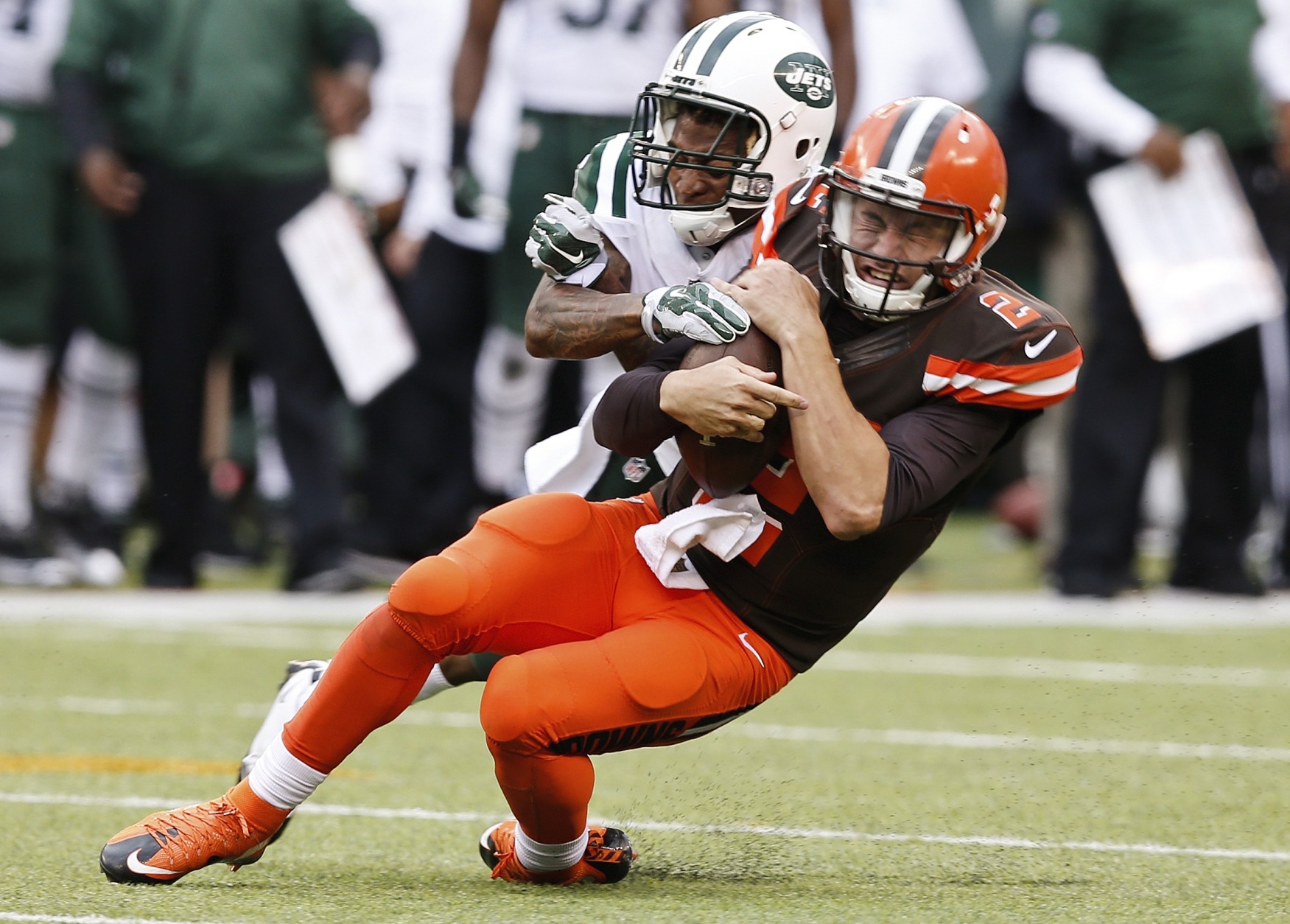 New York Jets defensive back Buster Skrine (41) tackles Cleveland Browns' Johnny Manziel (2) during the second half of an NFL football game Sunday, Sept. 13, 2015 in East Rutherford, N.J. The Jets won 31-10. (AP Photo/Kathy Willens)