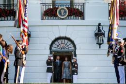 President Barack Obama and first lady Michelle Obama arrive on the South Lawn of the White House in Washington, Friday, Sept. 11, 2015, to observe a moment of silence to mark the 14th anniversary of the 9/11 attacks. (AP Photo/Andrew Harnik)