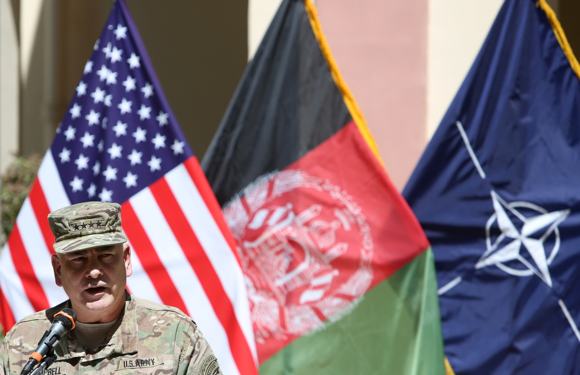 Commander of the International Security Assistance Force (ISAF), Gen. John Campbell, speaks during a memorial ceremony on the fourteenth anniversary of the 9-11 terrorist attacks on the United States at the headquarters of the International Security Assistance Force, in Kabul, Afghanistan, Friday, Sept. 11, 2015. (AP Photo/Rahmat Gul)